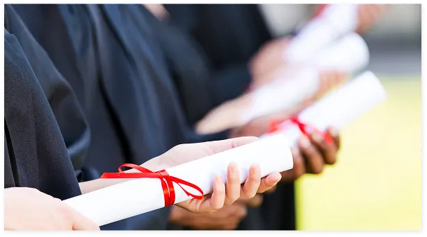 graduates with diplomas